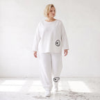 Oversizehose aus warmem French Terry mit Smileyprint gesmoktem Saum und Seitentaschen