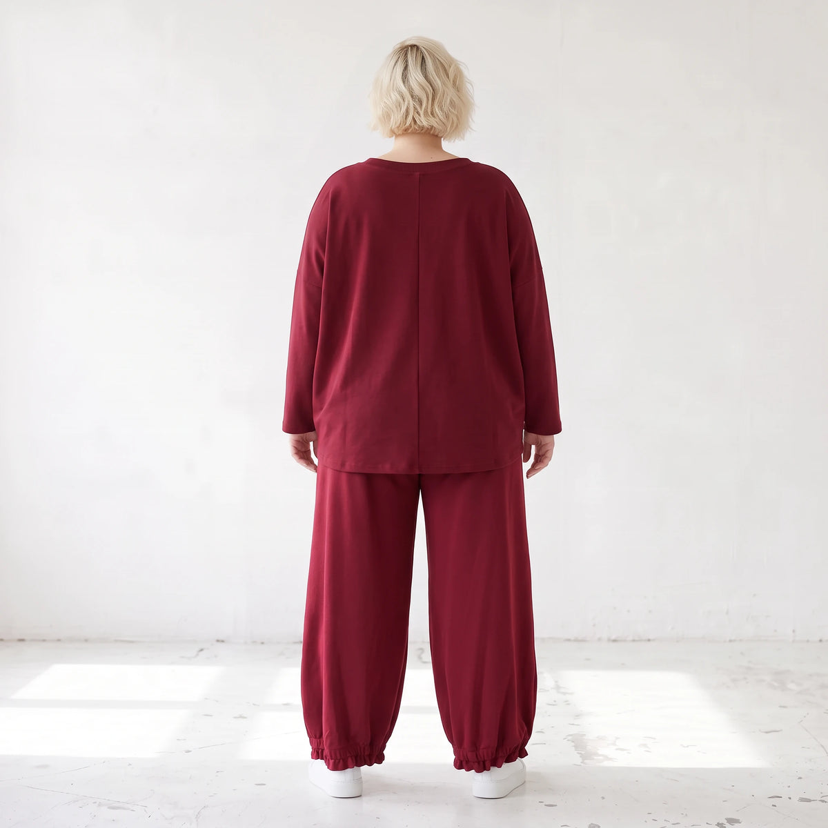 Oversized French Terry Hose in Schwarz mit Smileyprint gesmoktem Saum und weitem Bein