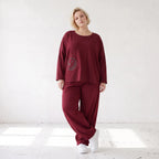 Oversized French Terry Hose in Schwarz mit Smileyprint gesmoktem Saum und weitem Bein