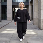 Oversized Hose aus flauschigem French Terry mit Smileydruck und bequem gesmoktem Saum