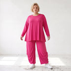 Pinkes Langarmshirt in Glockenform aus softer Slinkyqualität mit Rundhalsausschnitt