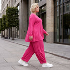Pinkes Langarmshirt in Glockenform aus softer Slinkyqualität mit Rundhalsausschnitt