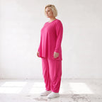 Pinkes Langarmshirt in Glockenform aus softer Slinkyqualität mit Rundhalsausschnitt