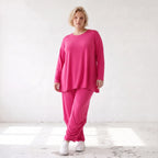 Pinkes Langarmshirt in Glockenform aus softer Slinkyqualität mit Rundhalsausschnitt