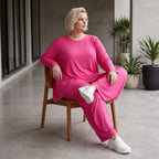 Pinkes Langarmshirt in Glockenform aus softer Slinkyqualität mit Rundhalsausschnitt