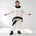 Rollkragenshirt aus fließendem Jersey mit Stretch Vokuhilaform mit seitlichen Schlitzen