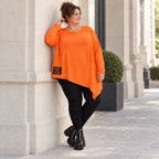 Orange Langarmshirt aus weichem Stretchjersey mit asymmetrischem Schnitt und Zipfelsaum